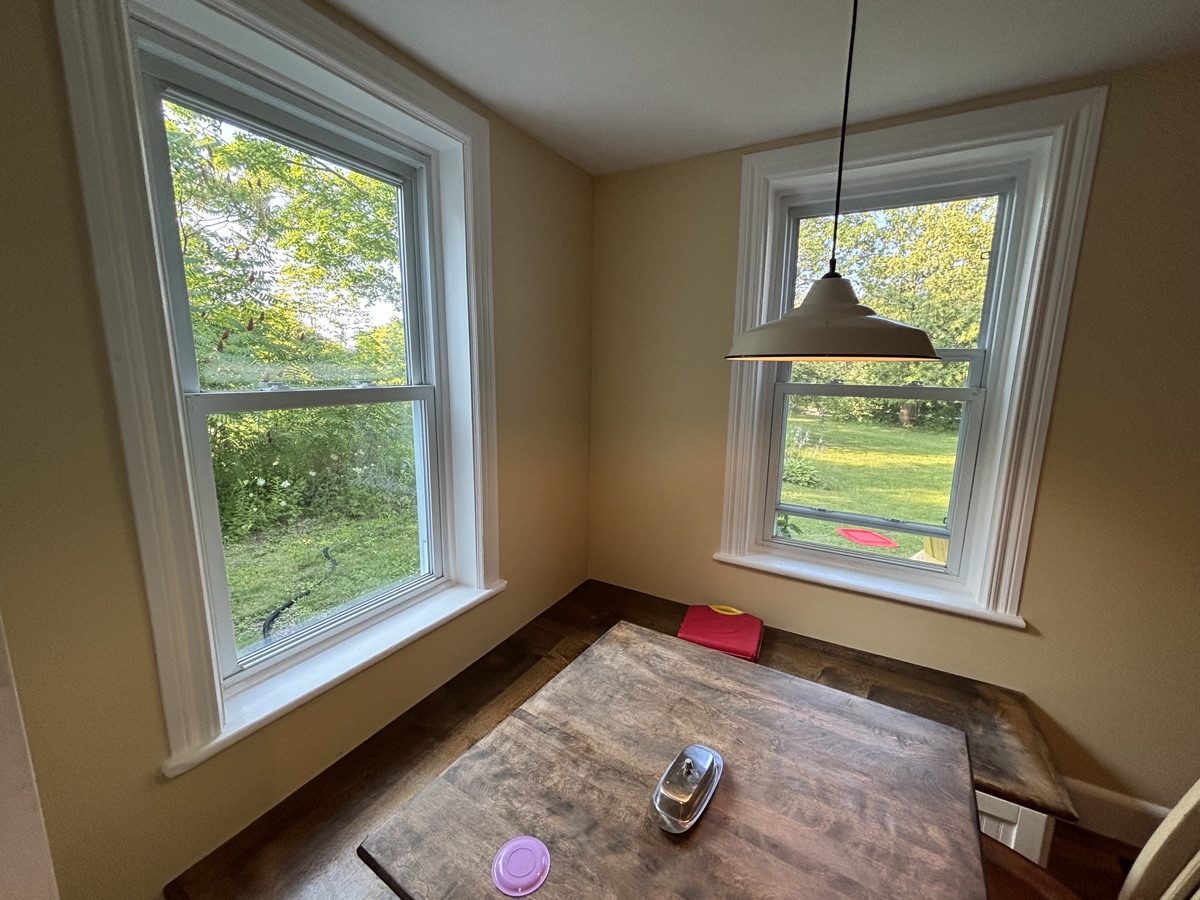 Freshly painted dining nook with large bright windows