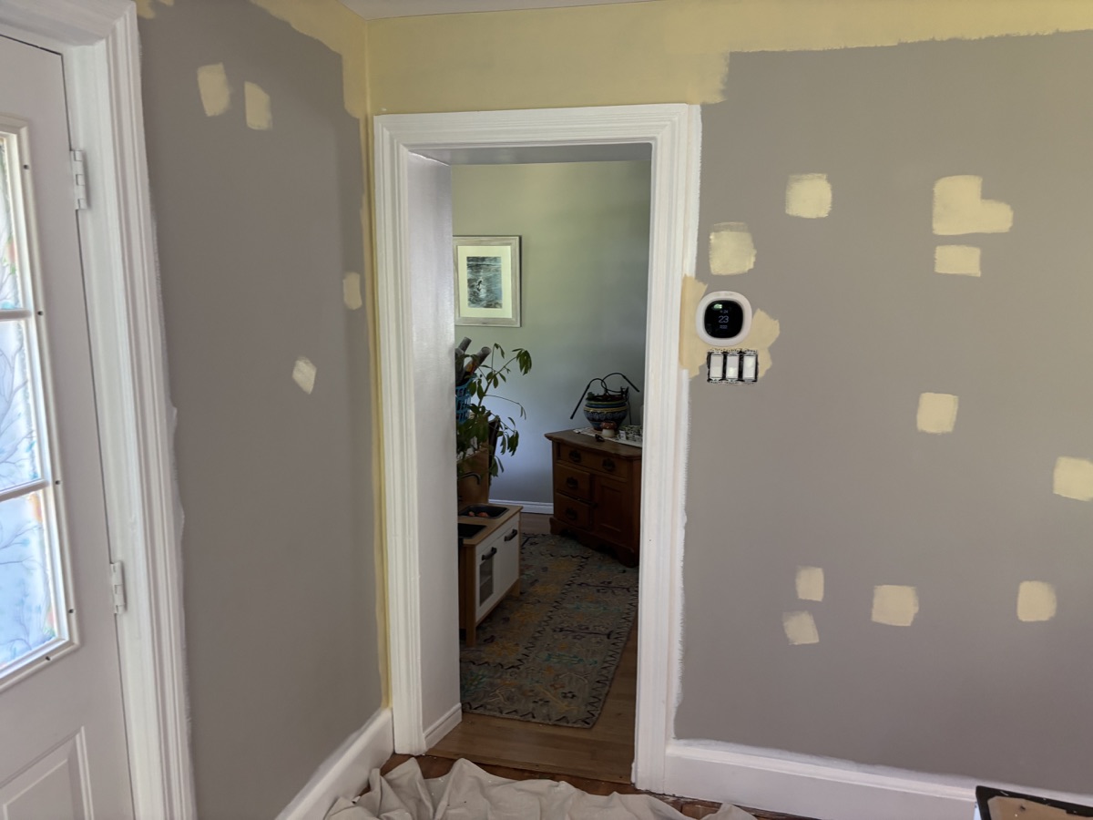 Drywall patch repair in progress before painting